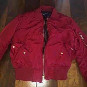 Woman's red puffer jacket.